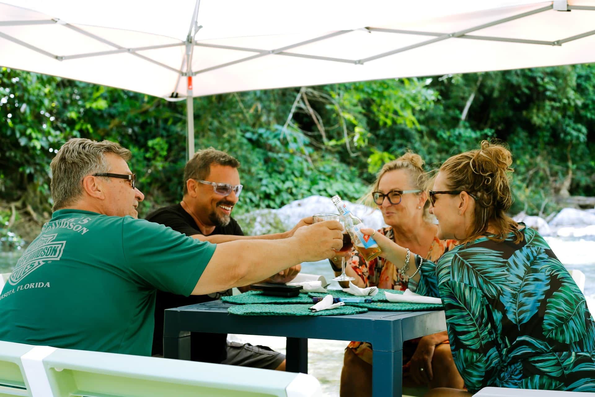 Guests enjoying riverside dining together